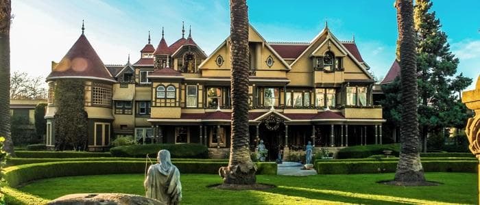  The Winchester Mystery House is giant with a huge lawn. 
